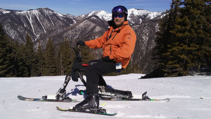 An adaptive skier enjoys renewed skiing agility and freedom on his iSkibike at Taos Ski Valley, Taos, New Mexico.